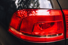 Taillight, Headlight Of A Modern Car Of Red Color Close-up.
