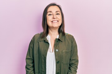 Poster - Middle age hispanic woman wearing casual clothes looking positive and happy standing and smiling with a confident smile showing teeth