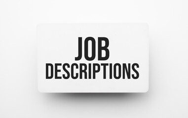 Job Descriptions sign on notepad on the white backgound