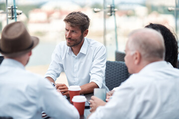 Wall Mural - group of entrepreneurs discussing a joint project sitting at a discussion table.