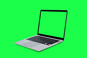 Wall Mural - Laptop computer with blank green screen isolated on green background.