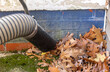 Close up of a tool used to suck up  leaves, called a a leaf vacuum