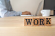 © ELUTAS - 仕事｜「WORK」と書かれたスタンプと仕事風景