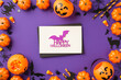 Top view photo of halloween decorations pumpkin baskets candy corn spiders web cat silhouette straws black envelope glitter purple bat inscription happy halloween white card isolated violet background
