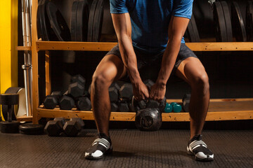 black latino man works out at the gym