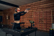 © Svitlana - Concentrated woman in earmuffs and safety glasses shooting a handgun