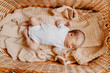 © Ananass - close up portrait of a little child on the bed in her room. Cute baby lies on blanket.