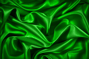 Wall Mural - Bright green silk satin background. Wavy soft folds on shiny fabric. Luxury background for design. Web banner. Holiday, anniversary, valentine, birthday, christmas.