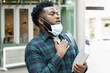 © 9nong - Sick Black African man student panting with face mask wearing, having breakthrough coronavirus infection with symptomatic pneumonia