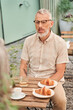 © Yakobchuk Olena - Serious man telling something to his wife during the cup of tea at the romantic date