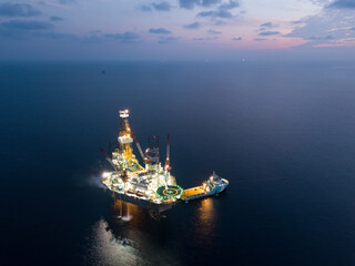 Wall Mural - Offshore Jack Up Rig in The Middle of The Sea at Sunset Time for Petroluem Exploration and Production