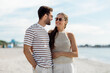 © Syda Productions - summer holidays and people concept - happy couple on beach in tallinn, estonia