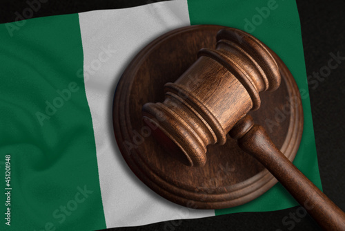 Judge Gavel and flag of Nigeria. Law and justice in Nigeria. Violation of rights and freedoms