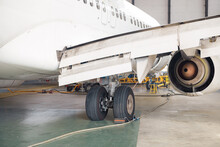 Close Up Shot Of Aircraft Wheel, Landing Gear In Airport Hangar. Plane, Shipping, Transportation Concept