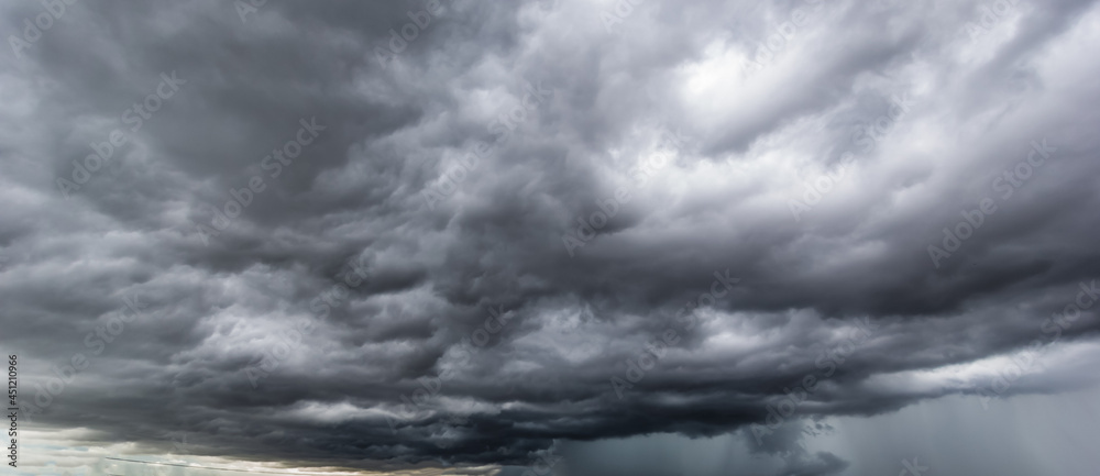 The dark sky with heavy clouds converging and a violent storm before ...