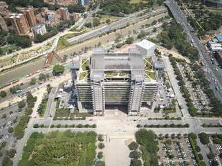 Poster - Aerial view of the buildings, roads and the green areas of the town on a gloomy day