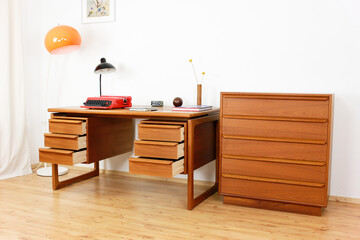 A mid century teak desk with drawers table from the 50s 60s Danish Design Vintage Dining solid wood Modern antique 50s 60s retro original isolated on white wall in modern living room side front view