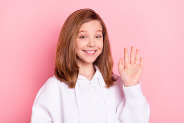 Sticker - Photo portrait girl waving hand on meeting smiling isolated pastel pink color background