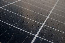 Macro Of A Solar Panel With Rain Drops On Its Surface