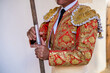 © ADDICTIVE STOCK - Unrecognizable bullfighter in traditional costume standing with lance