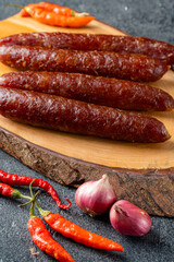 Wall Mural - Lap cheong or chinese sausage are dried pork sausages that look and feel like pepperoni but are much sweeter. In southwestern China, sausages are flavored with salt, red pepper and wild pepper.