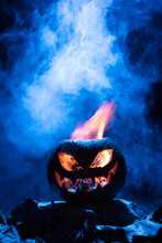 Close-up Of A Pumpkin On A Dark Background Prepared To Celebrate Halloween