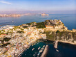 Aerial drone view of Italian island Procida. Marina Corricella and fort