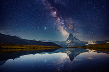 Famous Matterhorn Spire Under The Starry Sky. Switzerland, Europe.