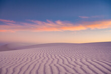 Rippling Sand Dune Stands Untouched At Sunset