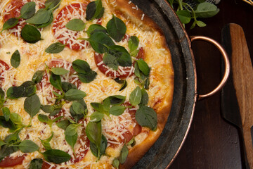 Brazilian pizza with pepperoni, cheese & arugula