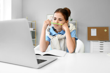 Sticker - Little schoolgirl studying online at home