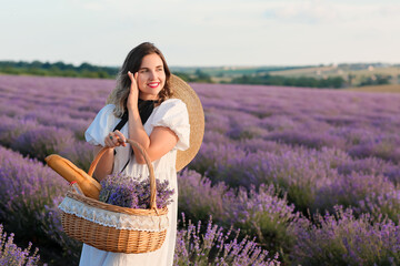 Sticker - Beautiful young woman with basket for picnic in lavender field