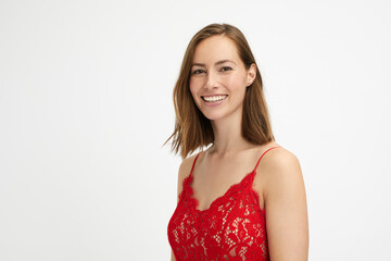 Wall Mural - Portrait of a beautiful young lady in a red dress looking being happy