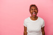 © Asier - Young african american woman isolated on pink background shouting very angry, rage concept, frustrated.