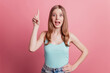 Portrait of genius smart excited lady raise finger have great idea on pink background