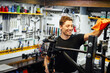© ADDICTIVE STOCK - Male mechanic wiping bicycle frame in garage