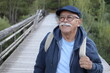 Ethnic senior man walking outdoors