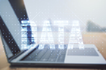 Poster - Creative Data word sign on modern laptop background. Multiexposure