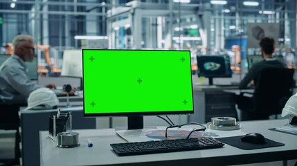 Fototapete - Car Factory: On the Desk Green Screen Chroma Key Computer. In Background Diverse Team of Engineers Work in Office of Automated Robot Arm Assembly Line Manufacturing Vehicles