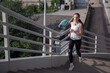 © Алексей Васильев - A woman runs up the stairs of the bridge. Evening training in the city.