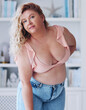 attractive plus size woman wearing jeans and summer top