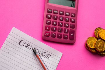 Canvas Print - Closeup of a paper with a pen and a stack of coins