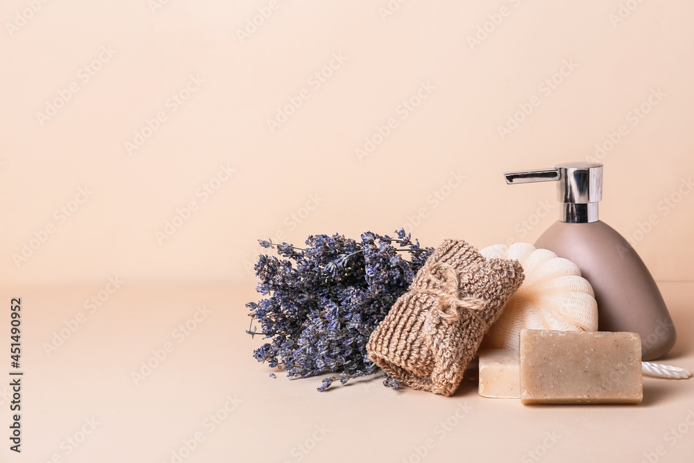 Composition with bath supplies and lavender flowers on color background