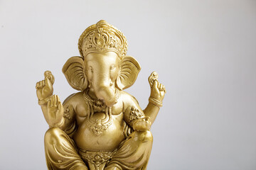 Wall Mural - Golden lord ganesha sclupture over white background. celebrate lord ganesha festival.