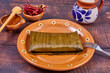 Comida típica mexicana, Tamales veracruzanos o jarochos, preparados con hojas de plátano, harina de maíz y adobo rojo. Alimento prehispánico. 