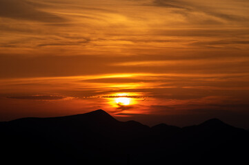 Wall Mural - silhouette of mountains at sunset in the carpathian mountains in summer