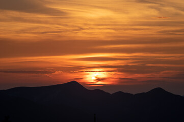 Wall Mural - silhouette of mountains at sunset in the carpathian mountains in summer