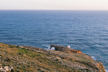 Poster - Natural sea arch formed by sea erosion at the tip of a headland called Ras il-Hamrija, Malta