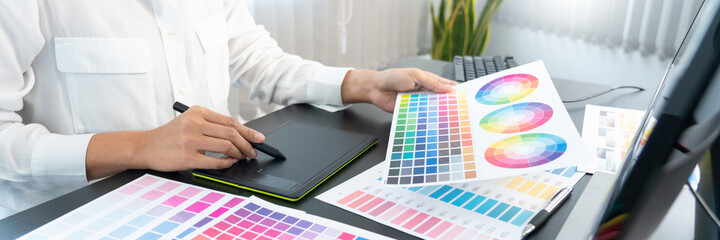 Poster - creative graphic designer choosing color scale for editing artwork while working in office.