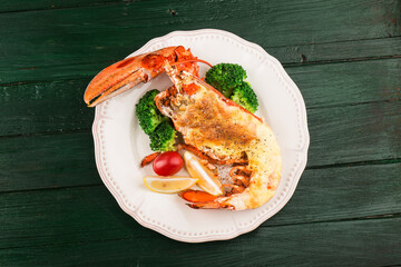 Wall Mural - Lobster Thermidor, grilled lobster stuffed with cream and cheese, served with lemon，Boston lobster with cheese